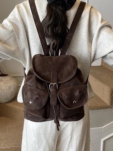 Retro large-capacity travel backpack in dark brown matte leather with flap cover