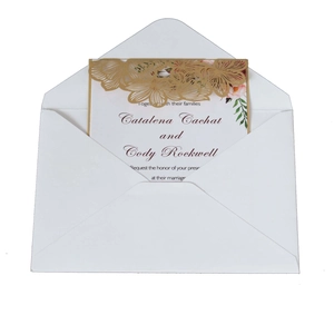 Detail of white V-flap envelope with gold laser-cut floral wedding invitation card