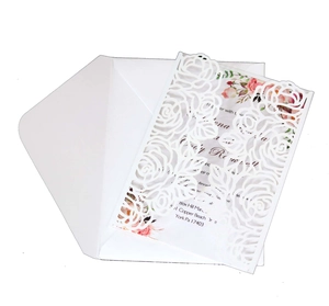 Elegant laser cut white rose wedding invitation suite with floral inner card and envelope