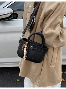 Minimalist black square crossbody bag with wooden beads and stylish leather belt buckle