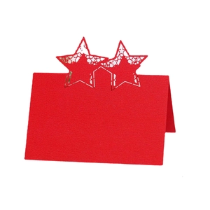 Laser-cut red star wedding place cards with hollow star design on a white background