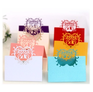 Laser cut heart bird place cards in various colors for wedding table settings
