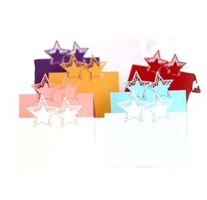 Laser cut star-shaped table cards in six vibrant colors for wedding seating