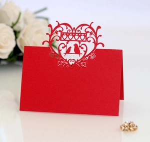Laser-cut red heart and bird wedding place card made of premium textured cardstock