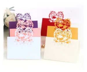 Laser cut gold love bird wedding place cards with hollow heart and floral paper designs