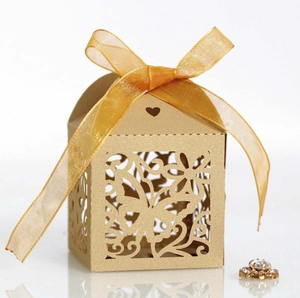 Golden laser cut butterfly wedding gift box with ribbon and intricate floral hollow design