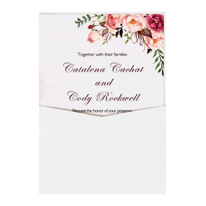 Close-up of white V-flap envelope with elegant floral wedding invitation card set