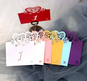 Laser cut heart wedding table number cards in seven vibrant colors for elegant events