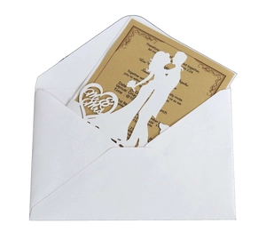 Detail of laser-cut wedding invitation with Mr & Mrs heart silhouette and inner card