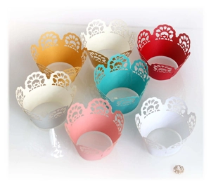 Assorted laser cut lace cupcake wrappers in multiple colors for party table decoration