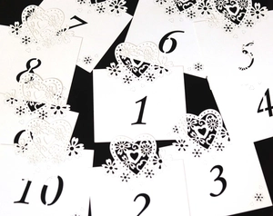 Elegant white heart laser-cut table numbers 1-10 for wedding or hotel party seating
