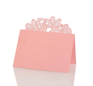Pink laser-cut rose hollow place cards for wedding table seating and guest arrangements
