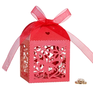Elegant red laser-cut wedding favor box with butterfly patterns and ribbon bow