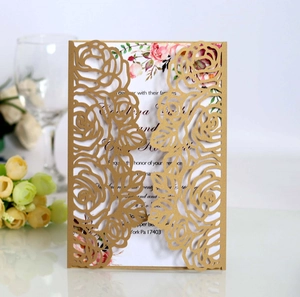 Detail of laser-cut rose patterns on elegant gold metallic business wedding invitation