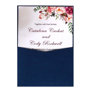 Elegant white wedding invitation with pink floral patterns and navy blue pocket envelope