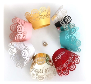 Laser cut lace cupcake liners with hollow floral patterns in multiple metallic colors