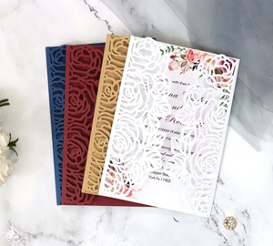 Elegant laser cut rose invitation set in burgundy and navy blue for weddings and events