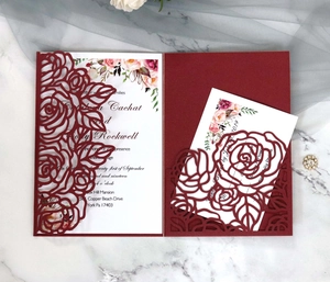 Detail of laser-cut rose hollow wedding invitation cards with premium floral cardstock