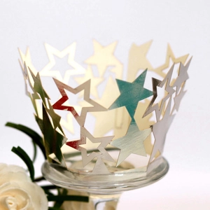 Detail of metallic hollow star cupcake liners in champagne, silver and mint gradient finish
