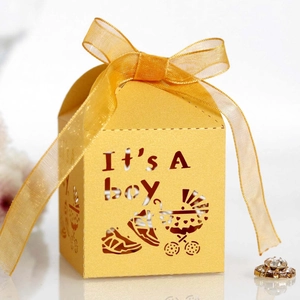 Detailed laser-cut yellow candy box featuring It's A Boy text and a ribbon bow tie