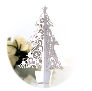 3D laser-cut white Christmas tree ornament with intricate snowflake and deer patterns