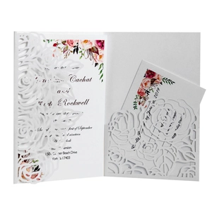 Blue rose laser-cut wedding invitation with watercolor floral inner card on white background