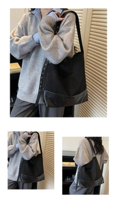 Close-up of black suede and leather patchwork bucket bag with metal eyelet strap detail