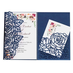 Laser-cut blue rose wedding invitation with floral inner card and hollow pattern cover