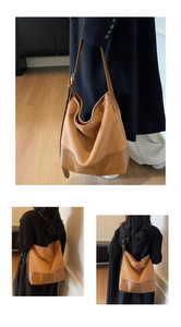 Detail of camel suede and leather hobo bag showing texture and adjustable shoulder strap