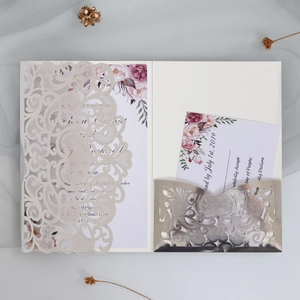Detailed laser-cut burgundy wedding invitation set with floral inner card and RSVP card
