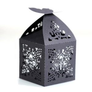 Elegant black laser-cut cross chocolate box with butterfly top for wedding favors
