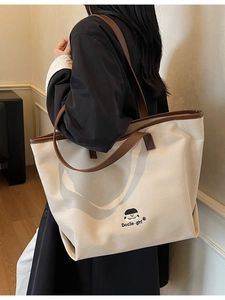 Minimalistische canvas draagtas met cartoon meisje borduurwerk en tekst erop