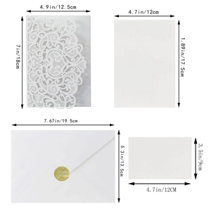 White laser-cut wedding invitation set with floral heart pattern and size measurements