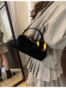 Vintage black suede crossbody bag with gold chain link and adjustable strap