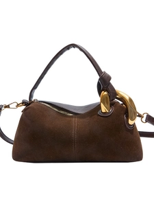 Vintage brown suede pillow handbag with oversized gold buckle and adjustable strap