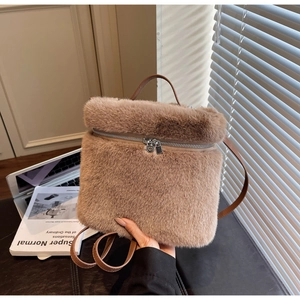 Detail of latte faux fur backpack with premium metal zipper and leather handle