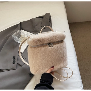 Detail showing plush beige faux fur texture and leather straps on stylish women backpack
