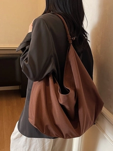 Retro large brown suede hobo bag with knotted shoulder strap and wooden bead details