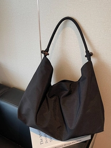 Minimalist large black suede commuter shoulder bag with decorative bead strap accents