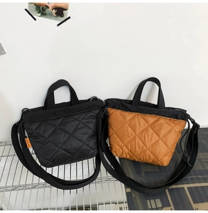 Quilted nylon bucket bags in black and caramel color with top handles and adjustable straps