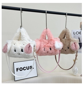 Close-up of three cute plush rabbit handbags in white pink and brown with leather straps