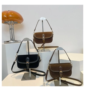 Detailed display of retro square crossbody bags in black and brown with suede texture