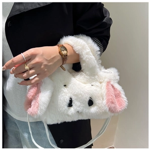 Detail of soft white plush rabbit handbag with cute pink long ears and embroidery