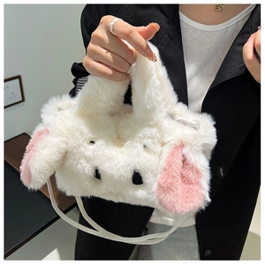 Detail of soft white plush bunny handbag with cute long ears and fluffy texture for women