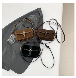 Detailed close-up of retro minimalist crossbody bags in brown and black matte leather textures