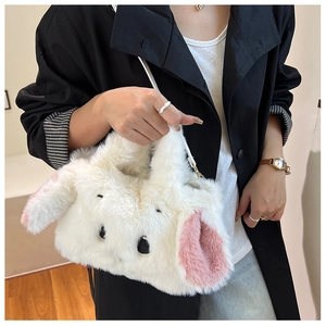 Detail of plush white rabbit bag showing long faux fur texture and pink ear lining
