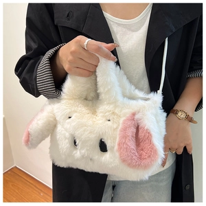 Detailed view of plush rabbit shoulder bag with soft white faux fur and pink ear accents
