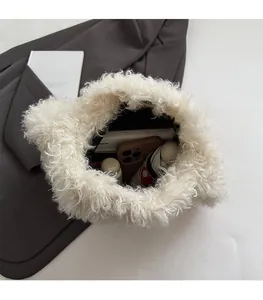Top view of plush white tote bag interior showing capacity for umbrella and phone