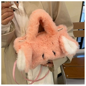Close-up of a pink plush rabbit handbag with long soft ears and stylish crossbody strap