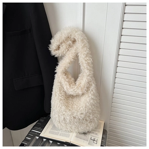 Detail of white faux fur shoulder bag texture with soft plush fabric on a lifestyle magazine